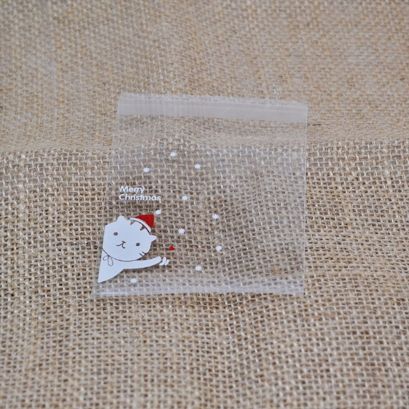 100Pcs Christmas Candy Bags Cute Plastic Gift Cookies Packaging Bags Biscuits Snack Candy Cake Packing Bags for Xmas Decoration